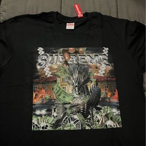 Brand new black a supreme shirt size medium.  Still in bag and has tag on it.